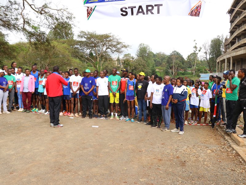Walkers and runners lined up at the start on the University of Embu